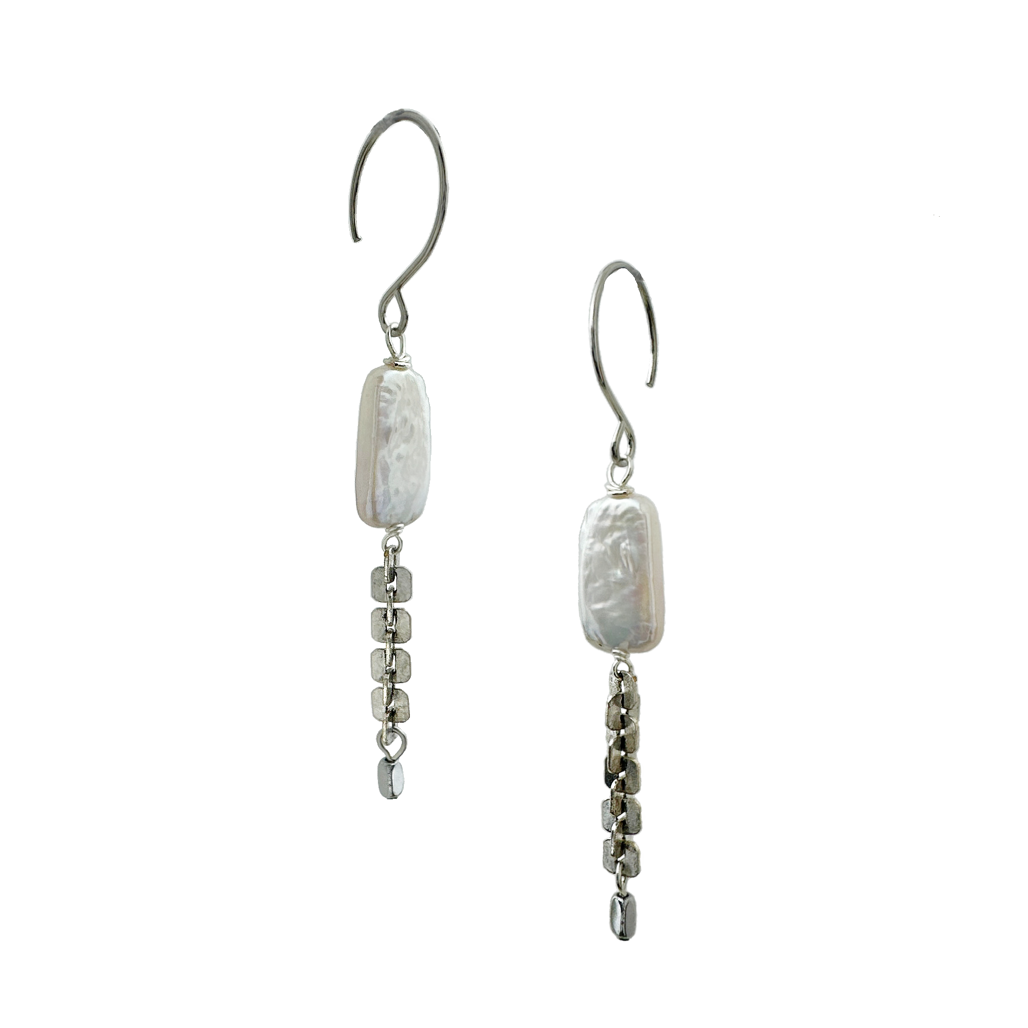A pair of silver-tone earrings featuring rectangular freshwater pearls, antique silver-plated textural chain with silver-plated hematite stones and stainless steel ear wires. Handcrafted by Alysian.