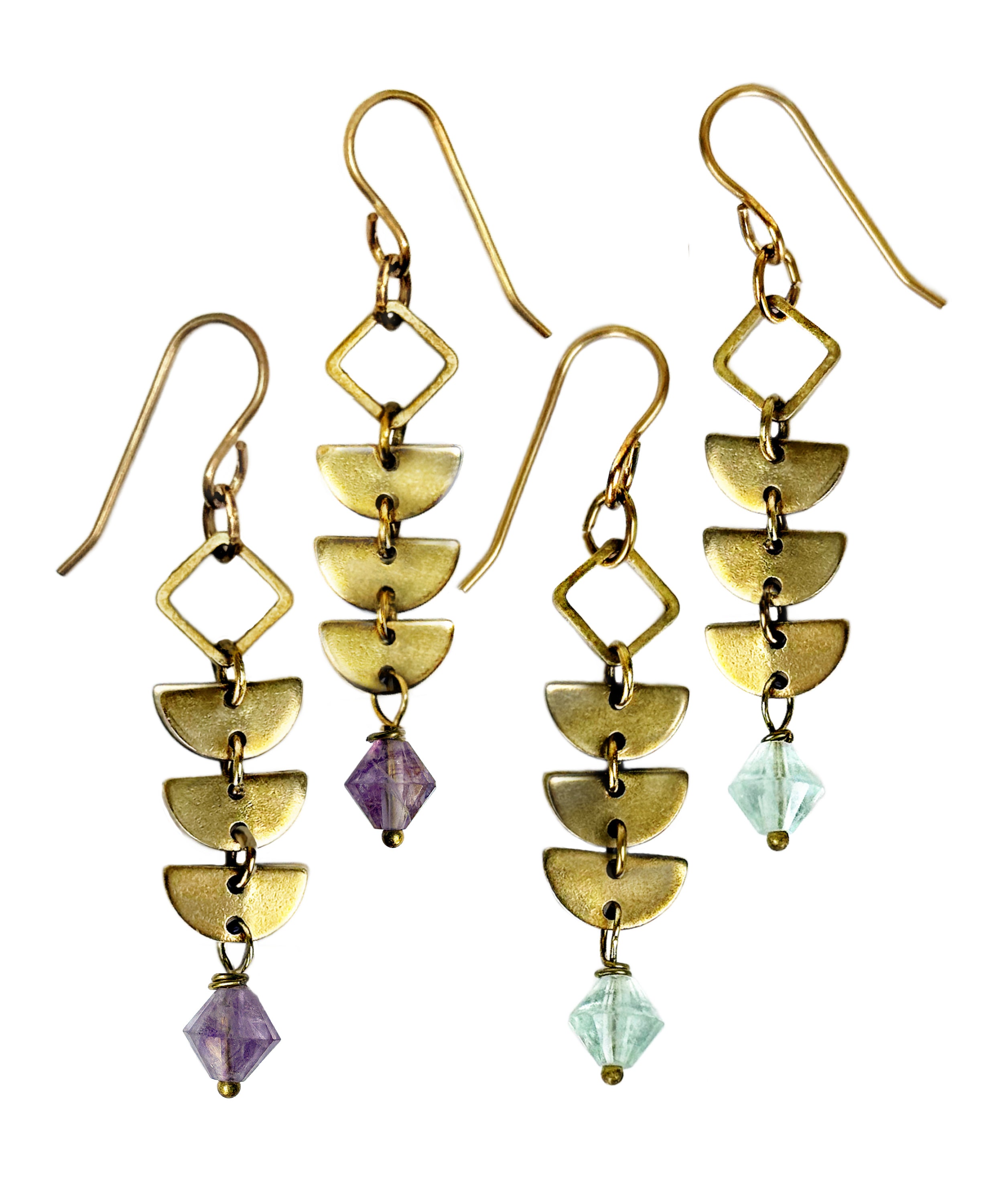 Two pairs of brass Alune Fluorite Earrings shown with green fluorite and also in purple fluorite. Handcrafted by Alysian.