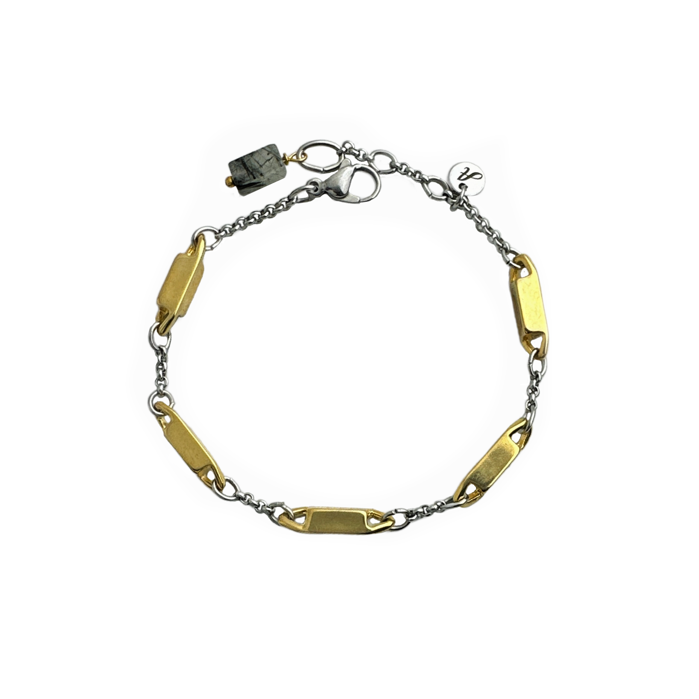 A sleek mixed metal bracelet with a combination of vintage gold-plated dimensional rectangular metal stations and small silver tone stainless steel rolo chain with a black rutilated quartz stone drop. By Alysian. 