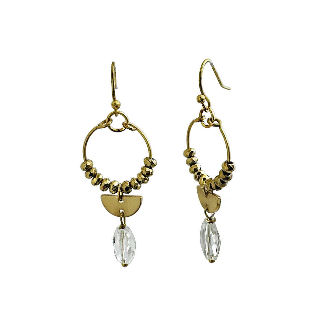 A pair of gold-colored brass wire hoop earrings beaded with gold hematite stones and featuring brass and crystal quartz charm drops.