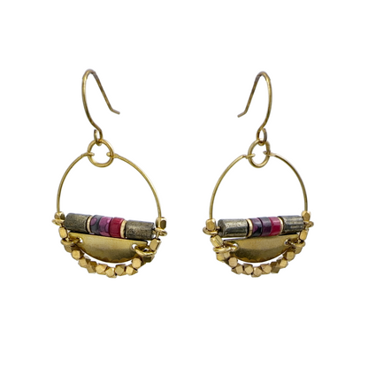 A pair of medium gold-colored brass wire hoop earrings with brass beaded details and smooth stones, including pyrite, jade and agate. Handcrafted by Alysian. 