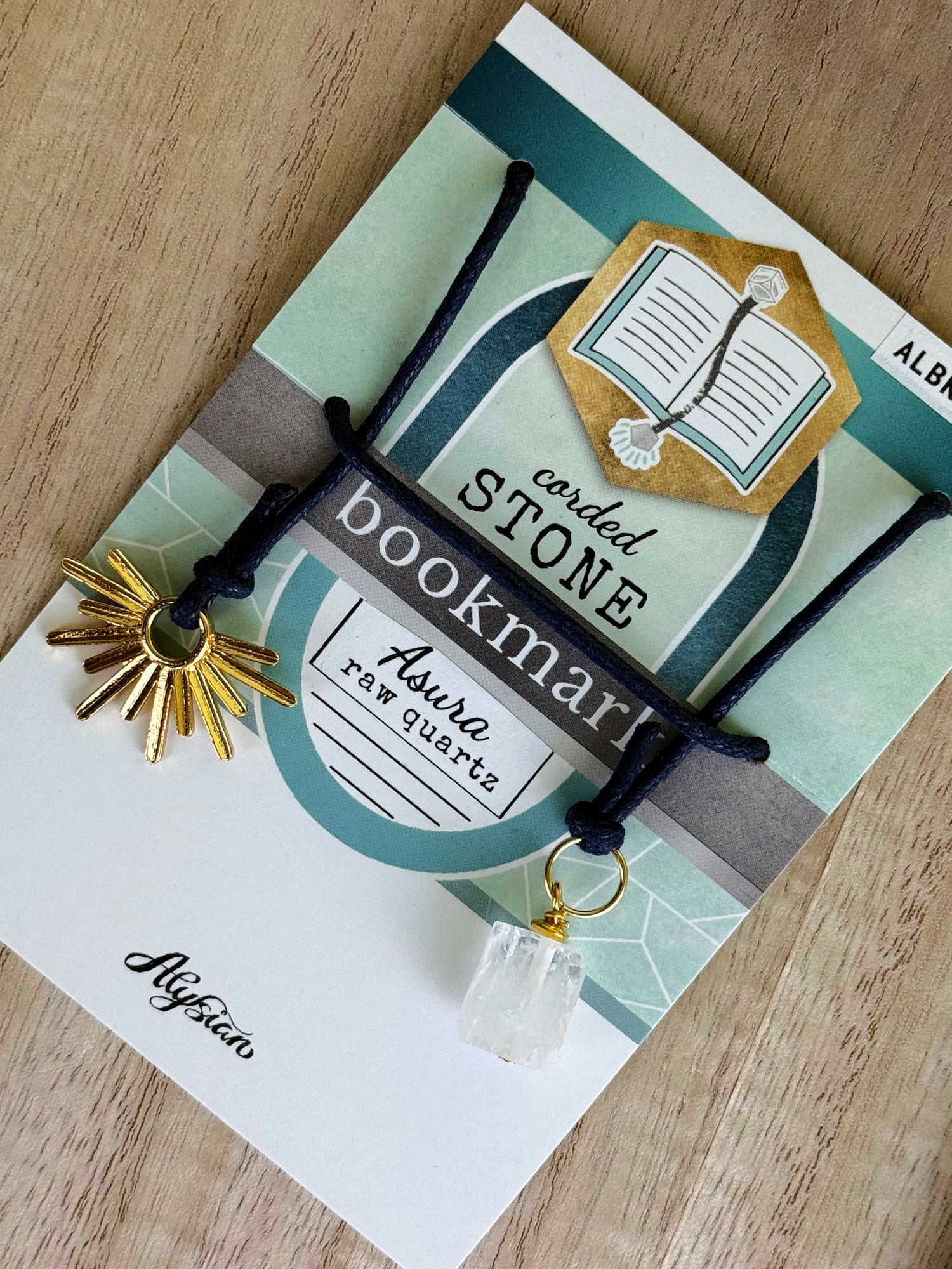 Asura Raw Quartz Bookmark – A handcrafted bookmark by Alysian - on  card packaging. 