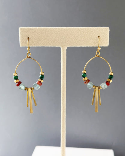 Brass hoop earrings with green malachite, sesame jasper and aqua apatite stones,  and edgy brass fringe on an earring stand — Soren apatite hoop by Alysian.