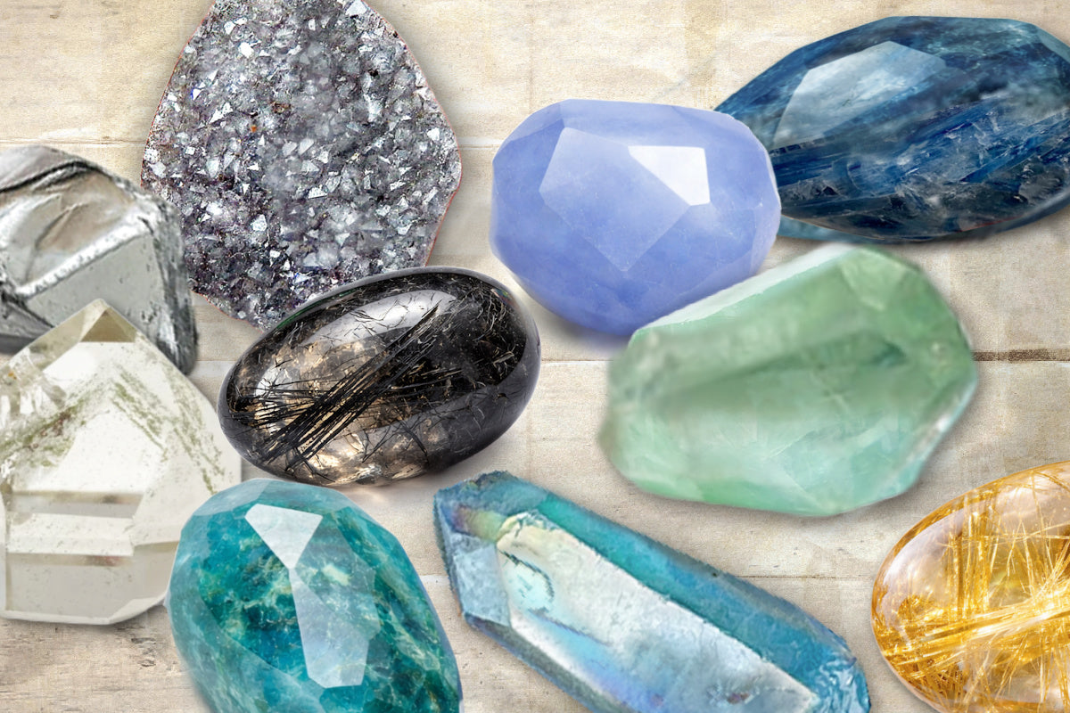 A montage of various luminous gemstones, each with unique texture and properties. Includes blue kyanite, apatite, blue chalcedony, rutilated quartz, tourmalinated quartz, druzy quartz, phantom quartz and fluorite.