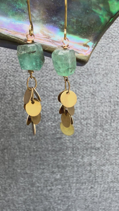 Video of pair of the Sedna Apatite Earring with organic-shaped smooth apatite stones and clusters of brass disc chain beneath, handcrafted by Alysian.