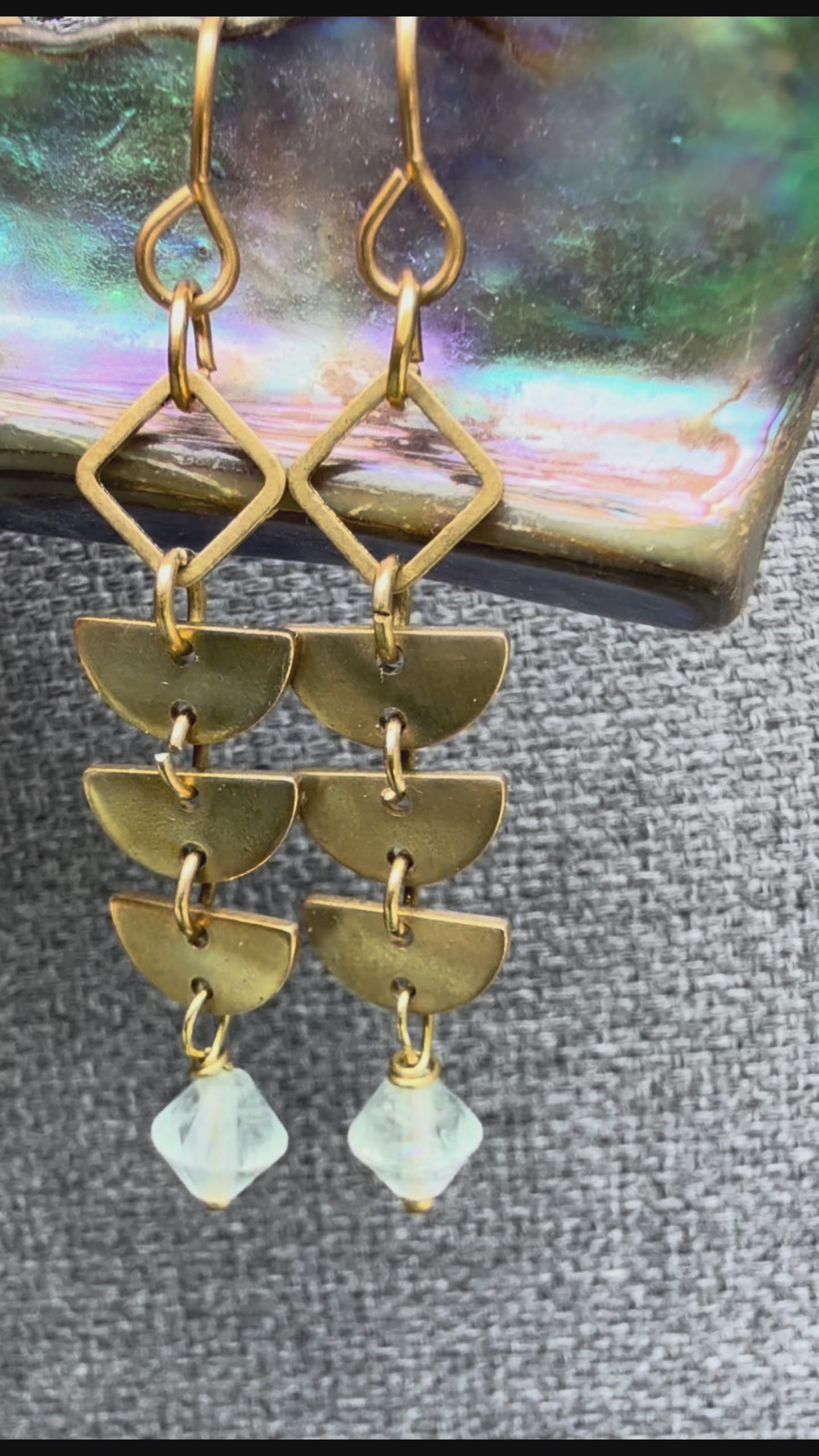A pair of brass Alune Fluorite Earrings shown with green fluorite. Handcrafted by Alysian.